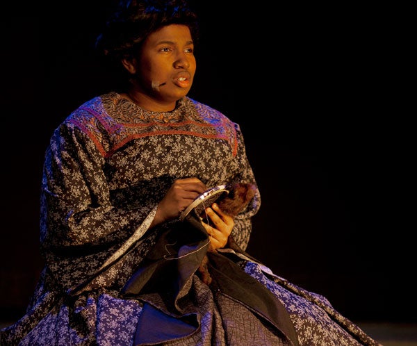 Shavonnia Corbin-Johnson (SFS '14), playing a former slave, performs onstage in the Davis Performing Arts Center.