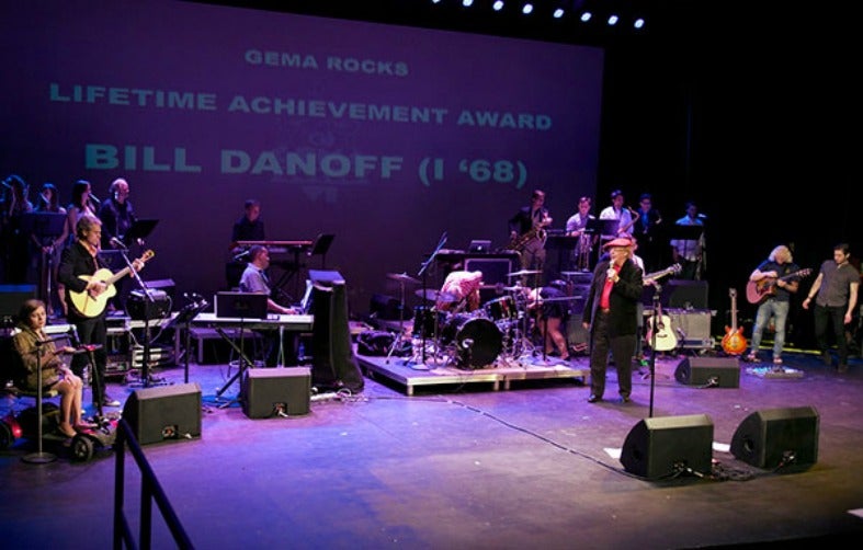 Bill Danoff performs with band on stage