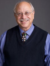 Philip Schrag smiles for the camera in a headshot.