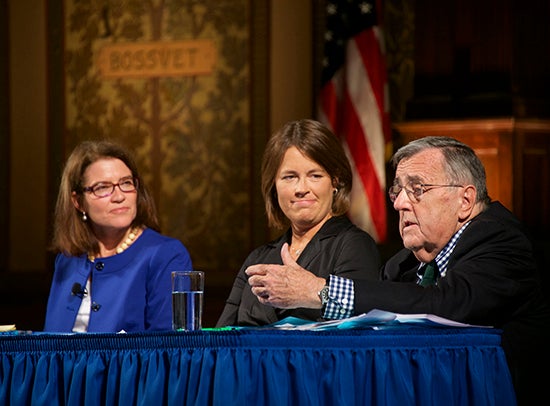 Mark Shields speaks as part of a panel onstage in Gaston Hall.