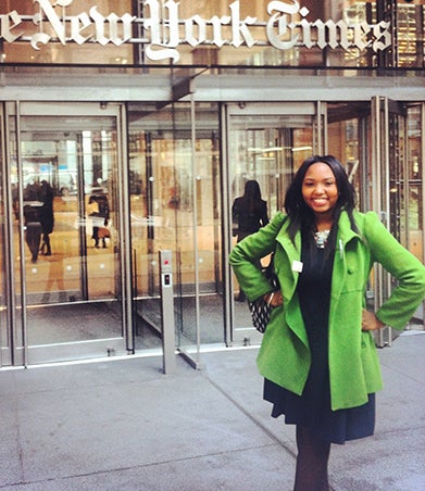 Aya Waller-Bey stands in front of The New York Times building