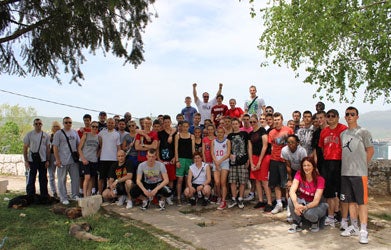 A group photo of Bosnia Basketball Diplomacy Program participants in Sarajevo, who have just cleaned up a local park as part of a service project.