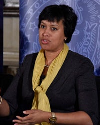 Muriel Bowser sits while speaking in Copley Formal Lounge