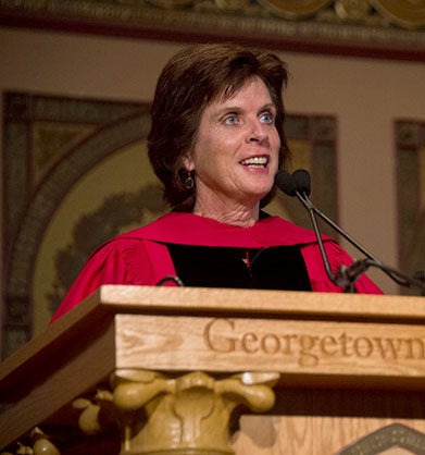 Louise Richardson speaks onstage on Gaston Hall.