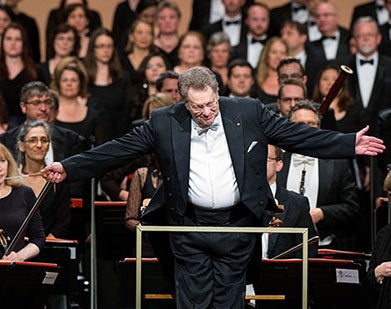 Sir Gilbert Levine conducting an orchestra.