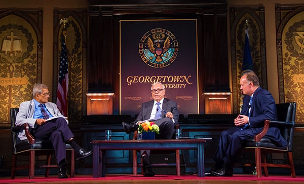 Amartya Sen, James Heckman and Georgetown President John J. DeGioia sit on stage and discuss the importance of global human development.