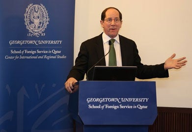 Dr. Daniel Lucey speaks to an audience from a podium.