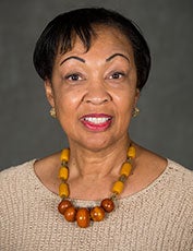 Gwendolyn Mikell smiles for the camera in a headshot.