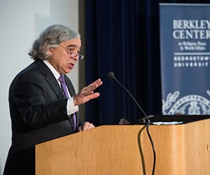 Energy Secretary Ernest Moniz speaks from a podium; a Berkley Center banner hangs in the background.