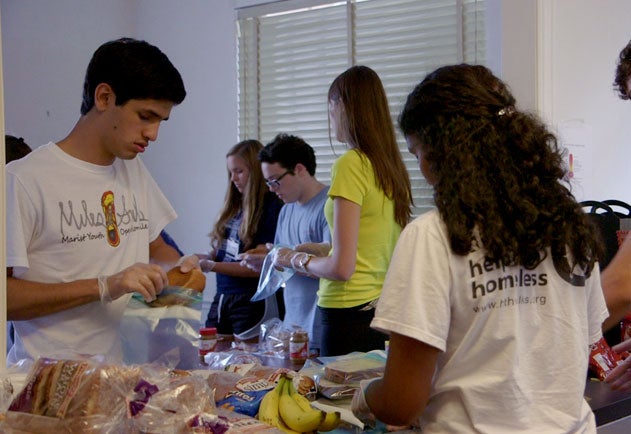 A group of students make sandwiches for the area's homeless population.