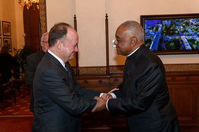 Geogetown President John J. DeGioia welcomes Archbishop Wilton Gregory to campus during his 2017 visit.