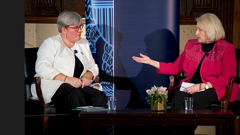 Rachel Kyte talks with Melanne Verveer, sitting onstage in Gaston Hall