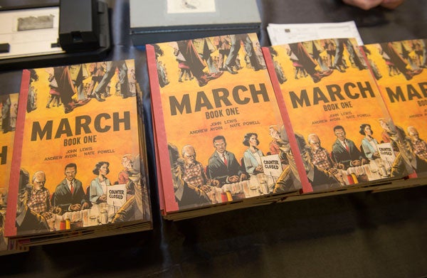 Copies of March: Book One lie on a table