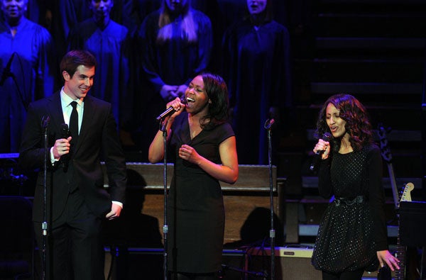 John Edward Crotty, Adaeza Jennifer Ezeofor and Meron Menwyelet sing on stage at Kennedy Center