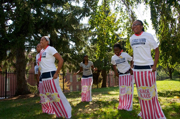 Andrea White, Jasmine Jackson, Kenya Kirkland, Sugar Rodgers and Samisha Powell hop in a sack race. 