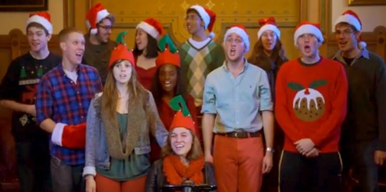 Georgetown Saxatones sing in Christmas outfits in Philodemic Room