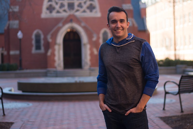 Connor Maytnier stands in front of Dahlgren Chapel.